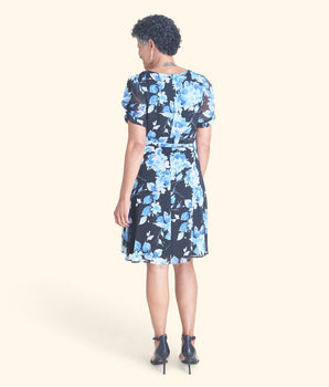 Woman posing wearing Blue Ashley Blue Floral Short Sleeve Dress from Connected Apparel