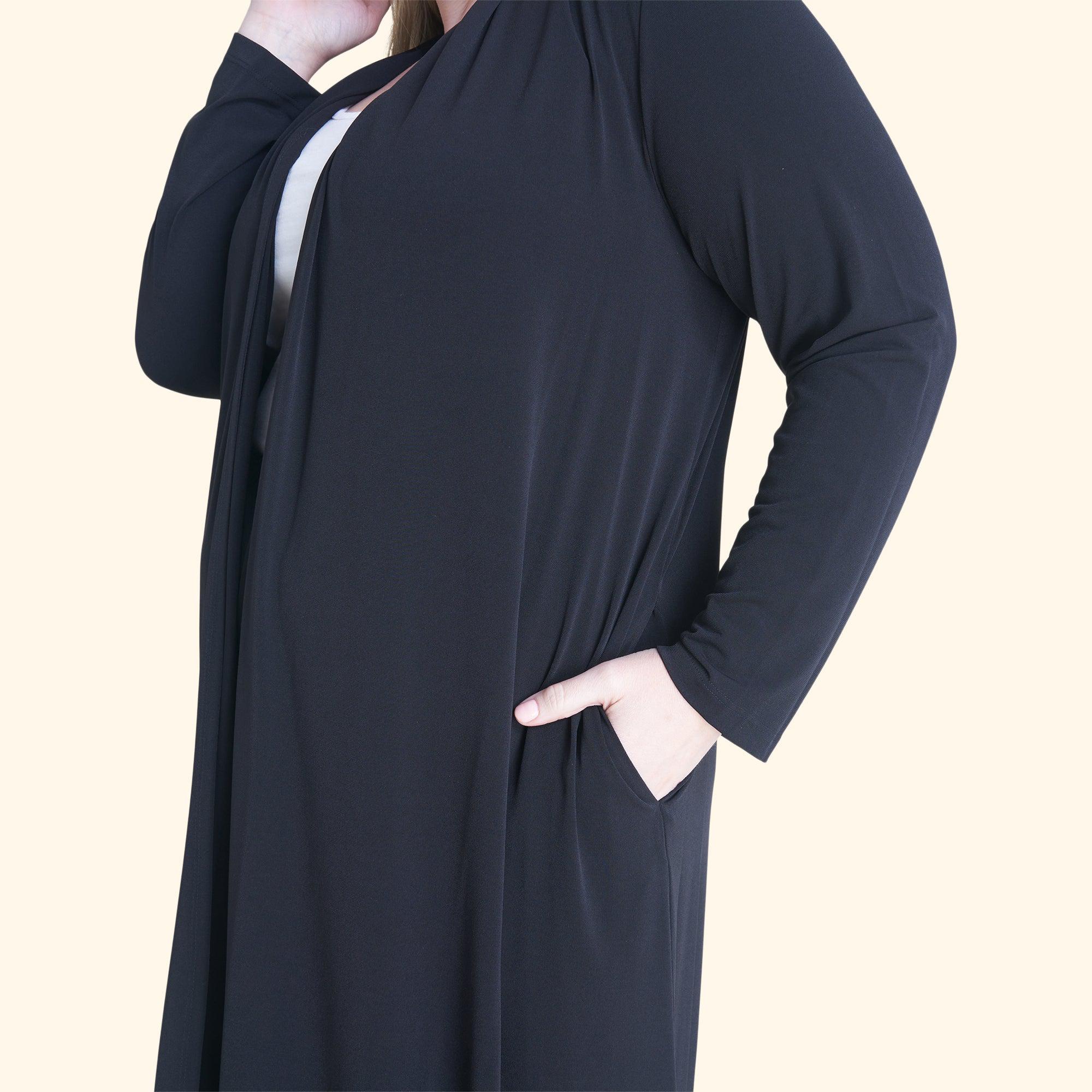 Woman posing wearing Black Bianca Black Open Front Cardigan from Connected Apparel
