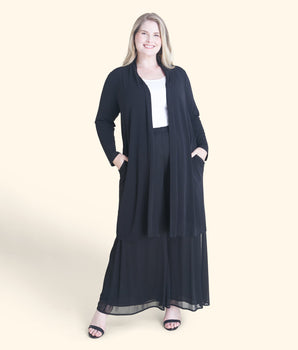 Woman posing wearing Black Bianca Black Open Front Cardigan from Connected Apparel