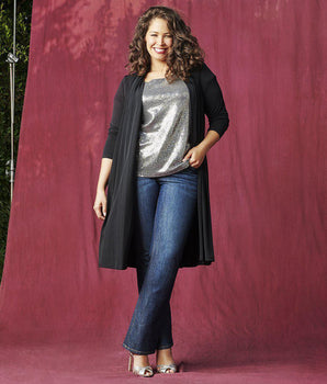 Woman posing wearing Black CAxLZ Bianca Black Open Front Cardigan from Connected Apparel