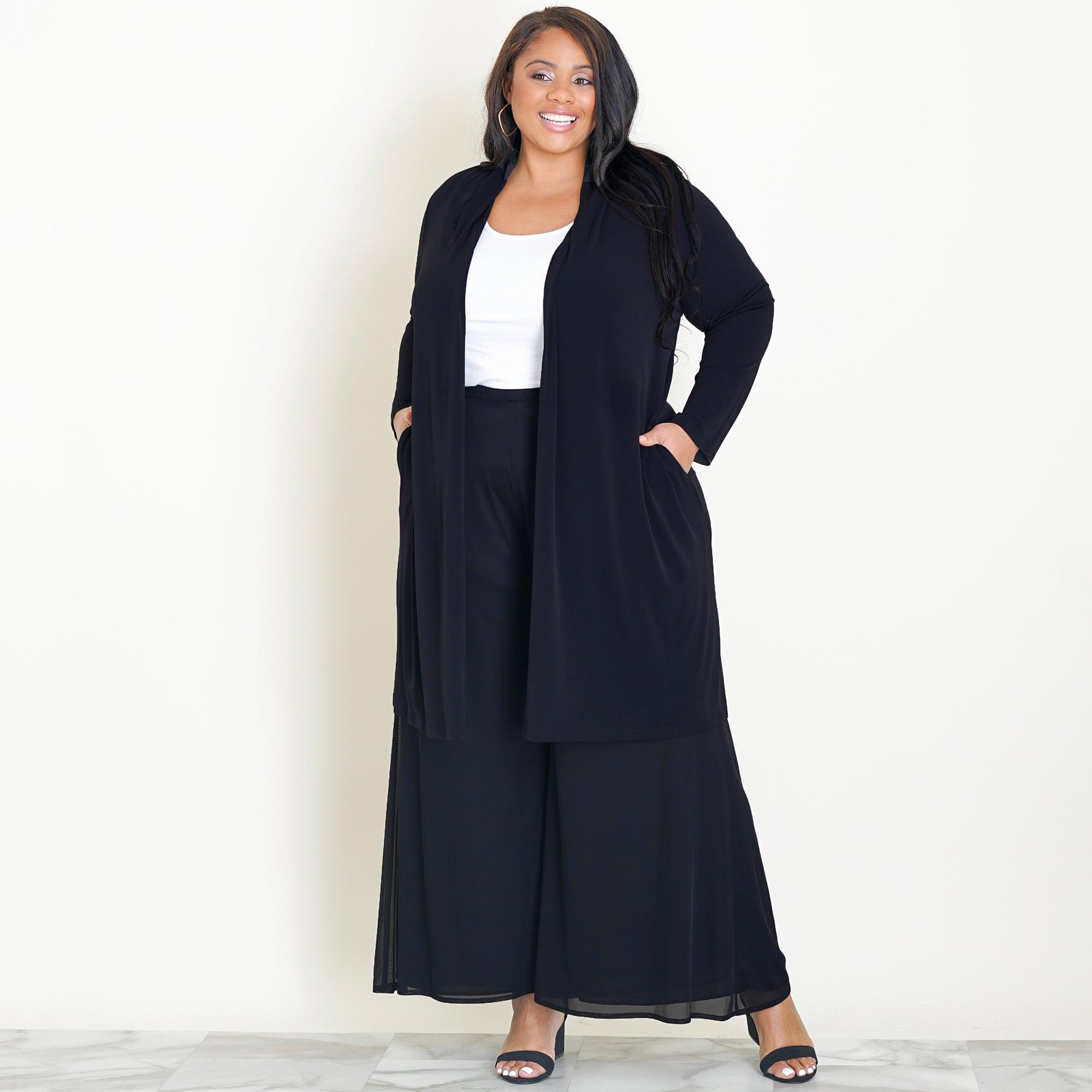 Woman posing wearing Black CAxLZ Bianca Black Open Front Cardigan from Connected Apparel