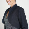 Woman posing wearing Black Adele Bolero Shrug from Connected Apparel