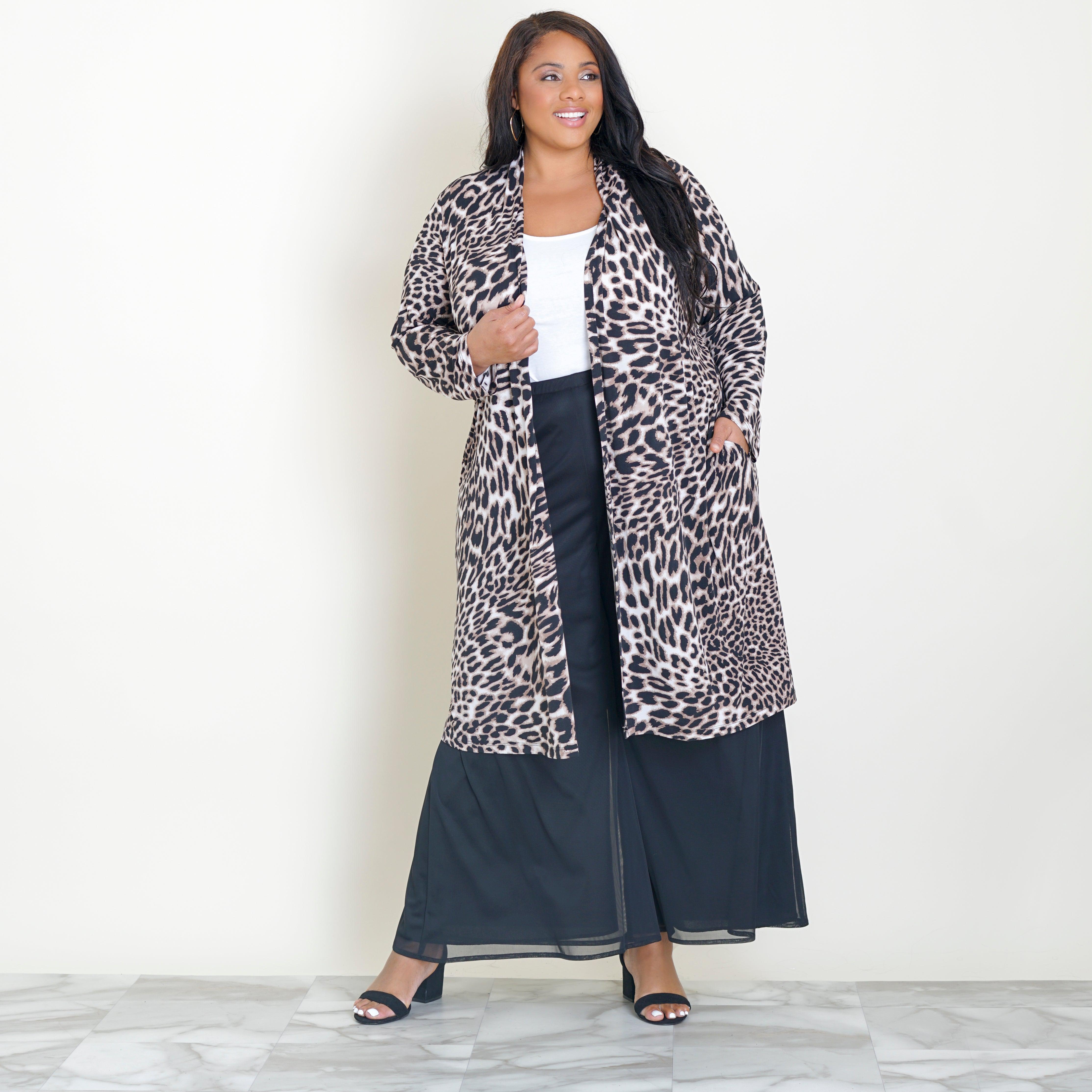 Woman posing wearing Black CAxLZ Bianca Leopard Print Cardigan from Connected Apparel