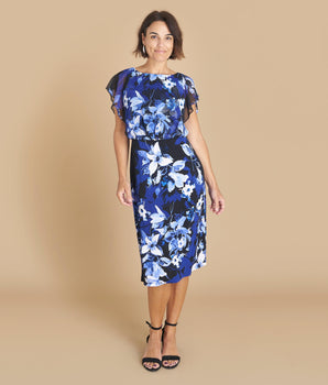 Woman posing wearing Cobalt Daphne Cobalt Floral Chiffon Popover Dress from Connected Apparel