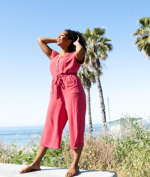 Woman posing wearing Rosewood Frida Rosewood Two-Pocket Jumpsuit from Connected Apparel