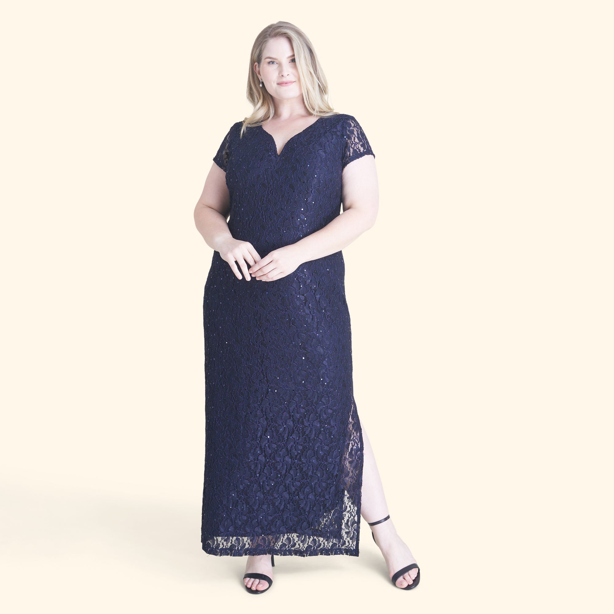 Woman posing wearing Navy Grace Navy Sequin Lace Dress from Connected Apparel
