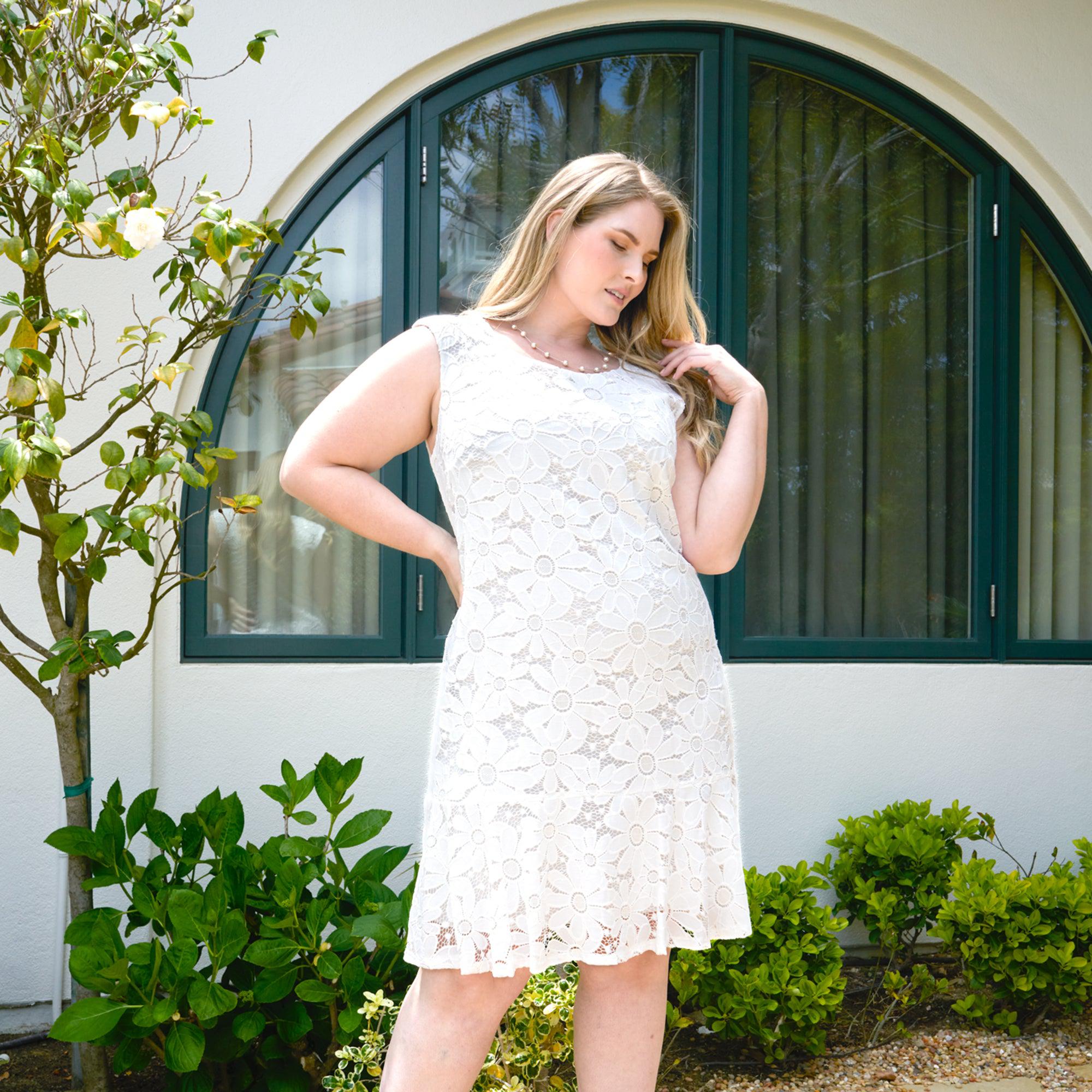 Woman posing wearing White Jessie White Floral Lace Dress from Connected Apparel