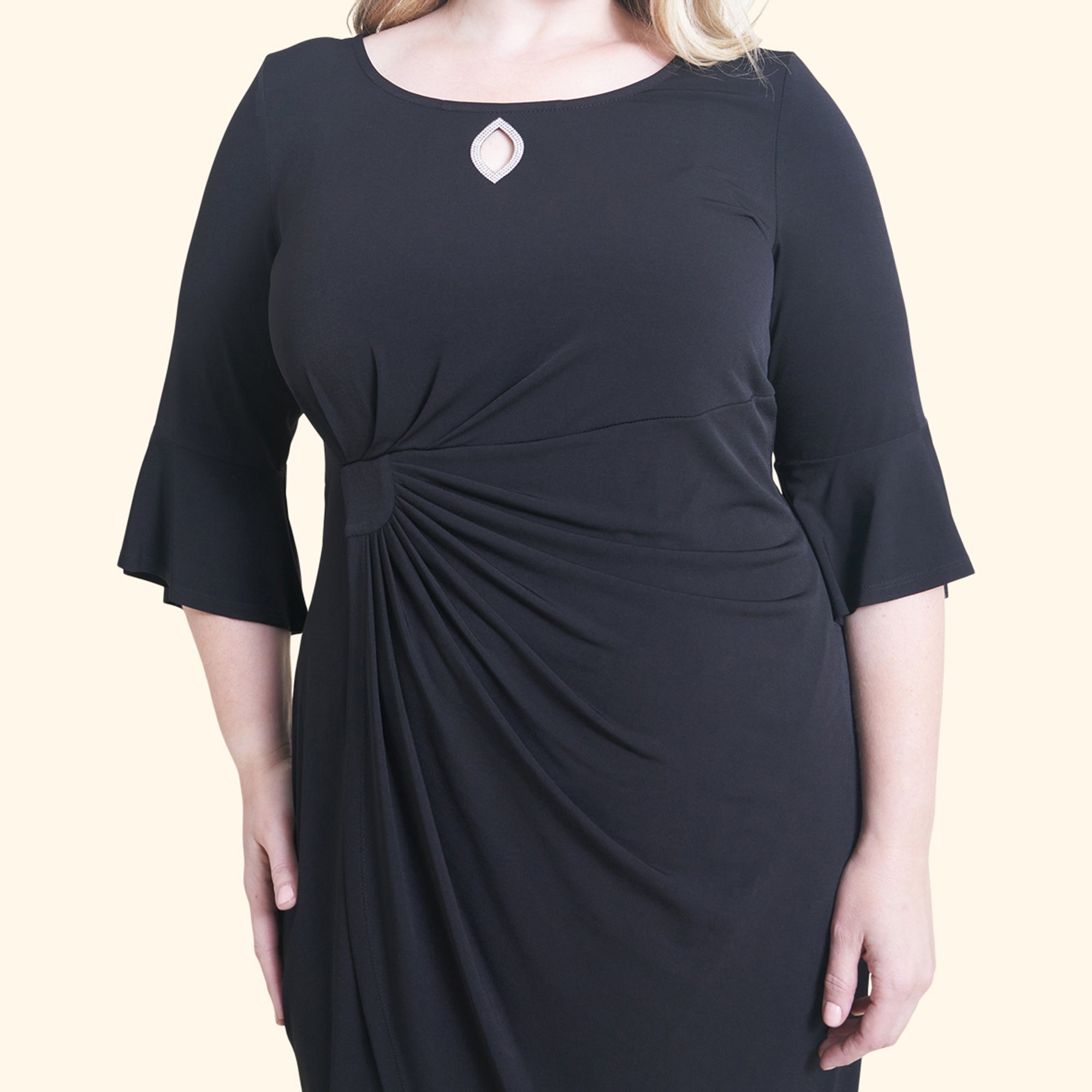 Woman posing wearing Black Lisa 2.0 Little Black Cocktail Dress from Connected Apparel