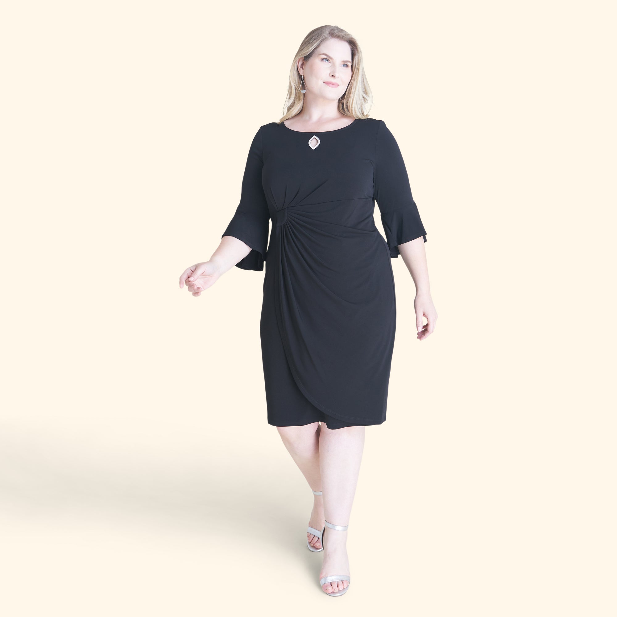 Woman posing wearing Black Lisa 2.0 Little Black Cocktail Dress from Connected Apparel