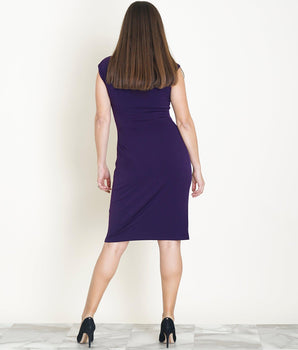 Woman posing wearing Eggplant Lisa Eggplant Sleeveless Faux Wrap Dress from Connected Apparel