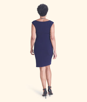 Woman posing wearing Navy Lisa Navy Sleeveless Dress from Connected Apparel