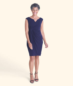 Woman posing wearing Navy Lisa Navy Sleeveless Dress from Connected Apparel