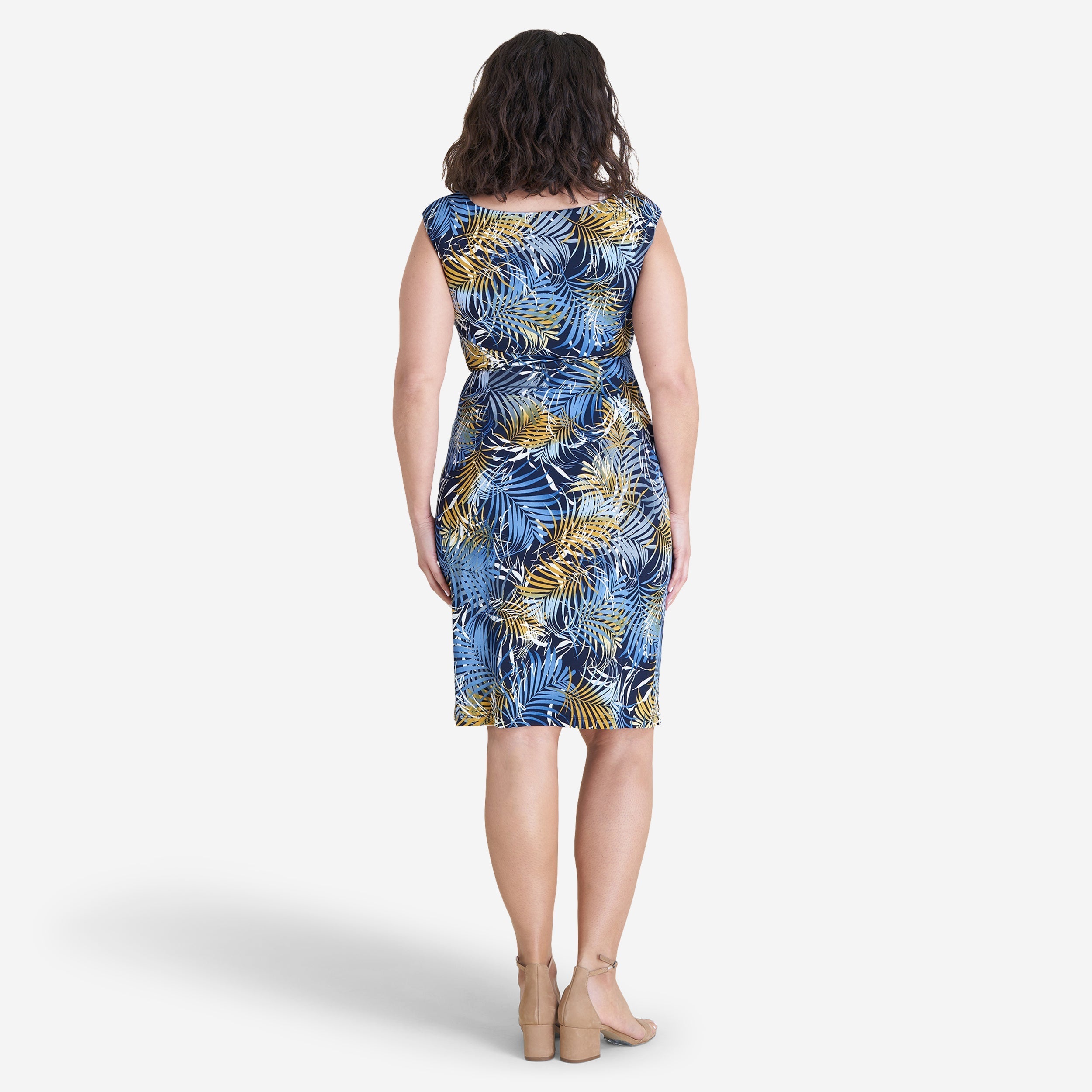 Woman posing wearing Navy/Mustard Lisa Faux Wrap Dress from Connected Apparel
