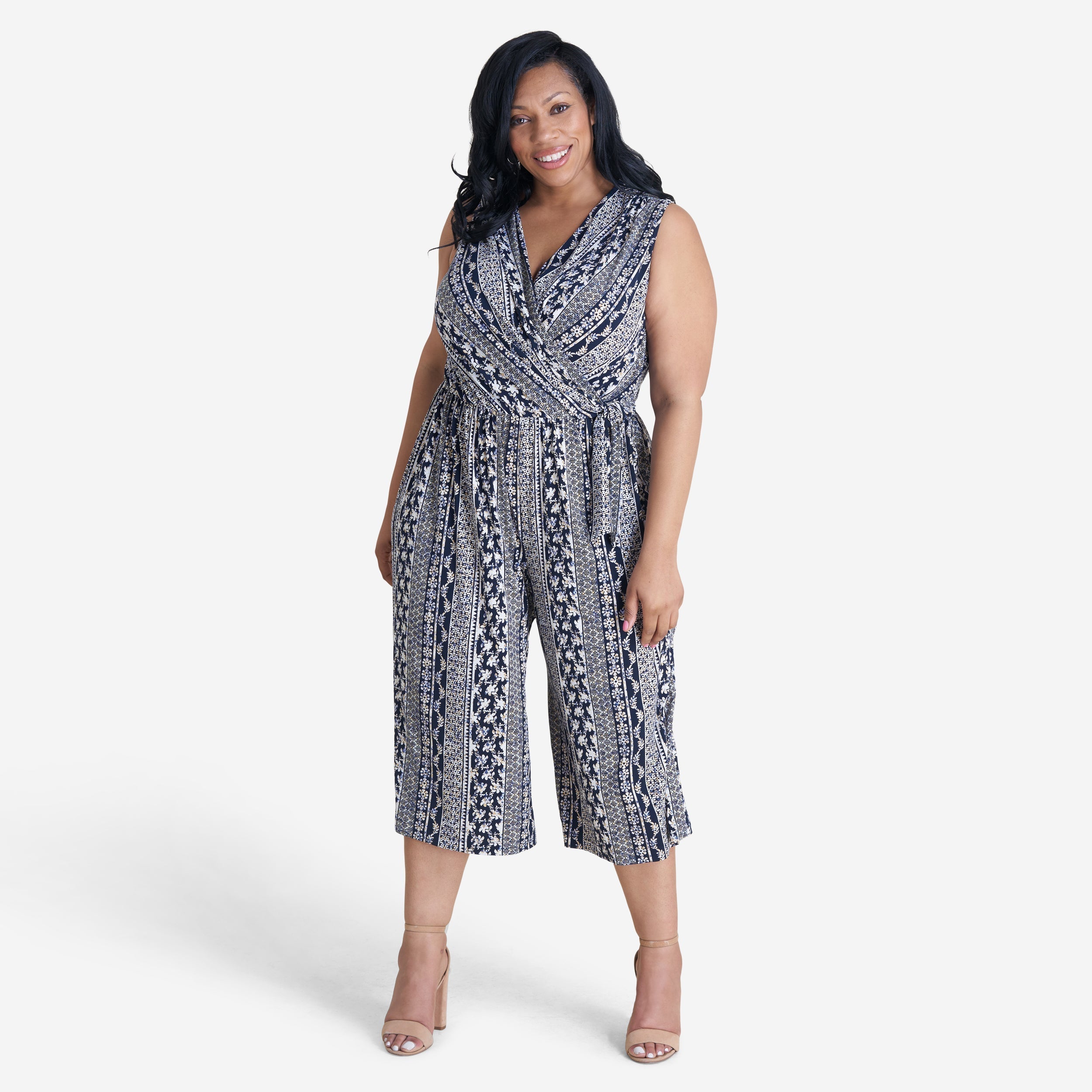 Woman posing wearing Navy/Maize Morgan Cropped Jumpsuit from Connected Apparel