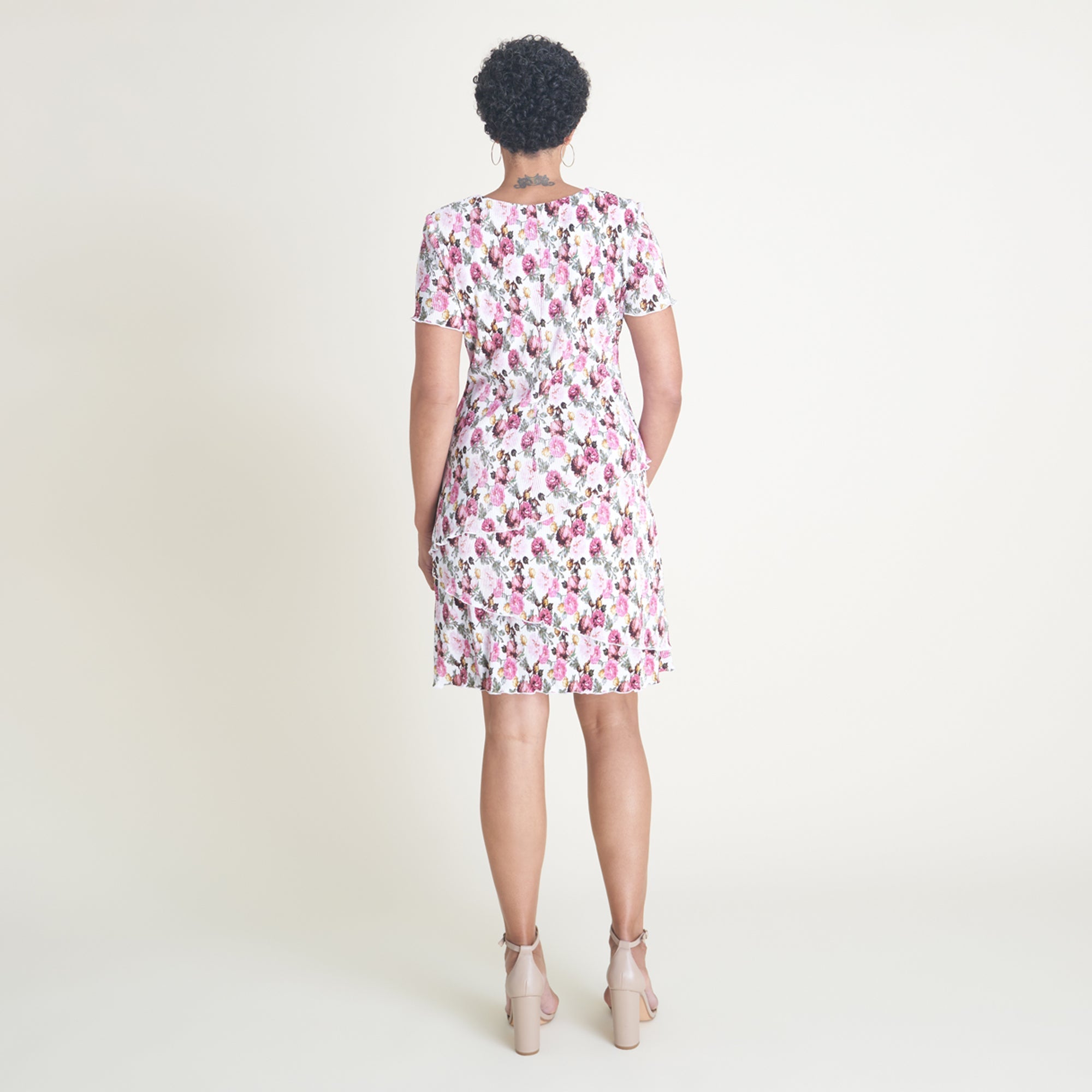 Woman posing wearing Ivory/Rose Penny Floral Bodre Sheath Dress from Connected Apparel