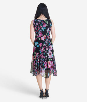 Woman posing wearing Black Sabrina Patchwork Floral Mesh Dress from Connected Apparel