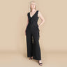 Woman posing wearing Black Sara Black Jumpsuit from Connected Apparel