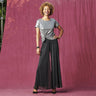 Woman posing wearing Black CAxLZ Sheri Black Palazzo Pant from Connected Apparel