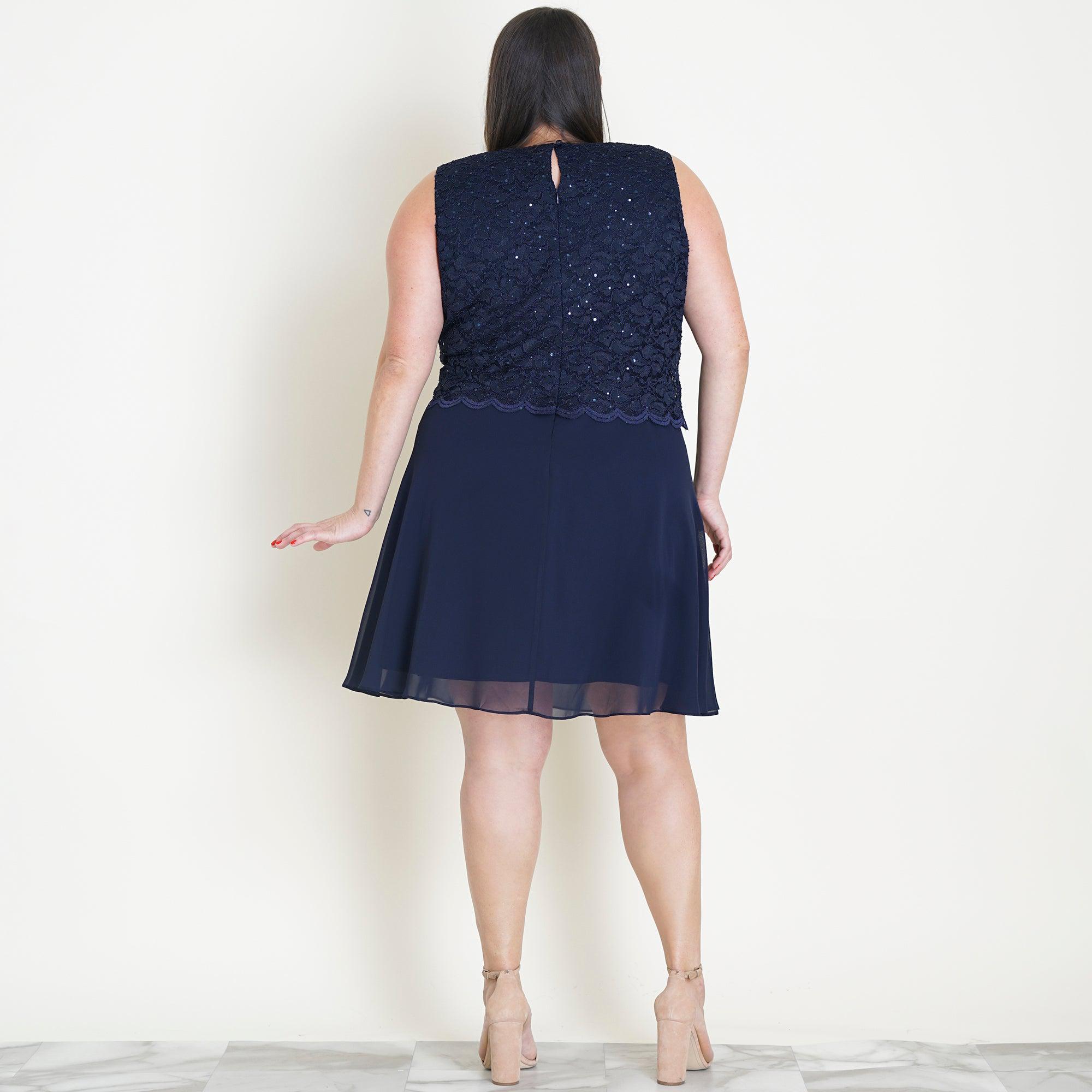 Woman posing wearing Navy Sofia Navy Sequin Lace A-Line Dress from Connected Apparel