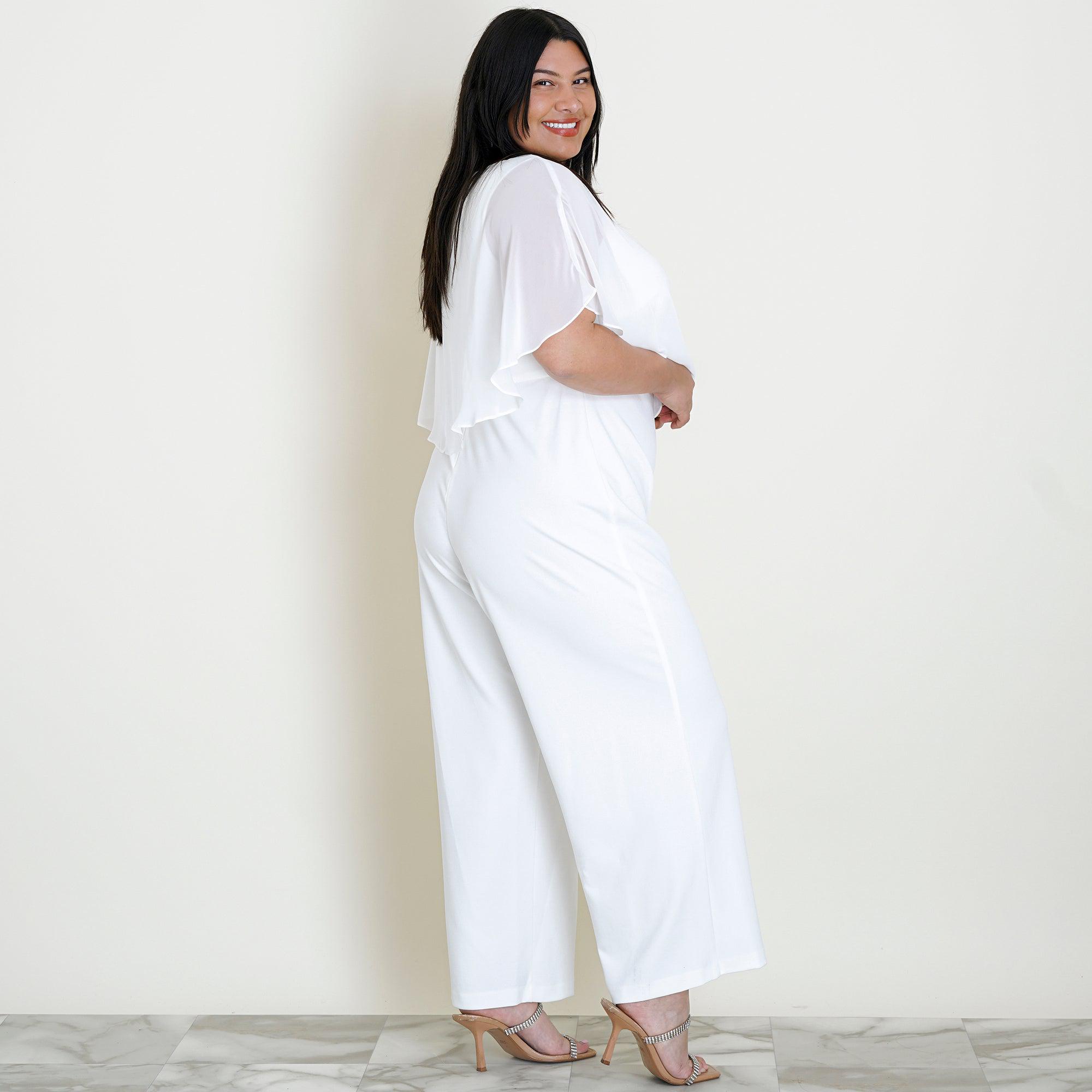 Woman posing wearing Ivory Sunny 2.0 Chiffon Capelet Ivory Jumpsuit from Connected Apparel