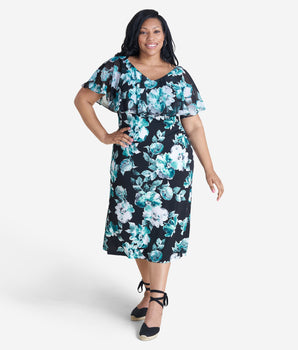 Woman posing wearing Teal Sunny Teal Floral Midi Dress from Connected Apparel