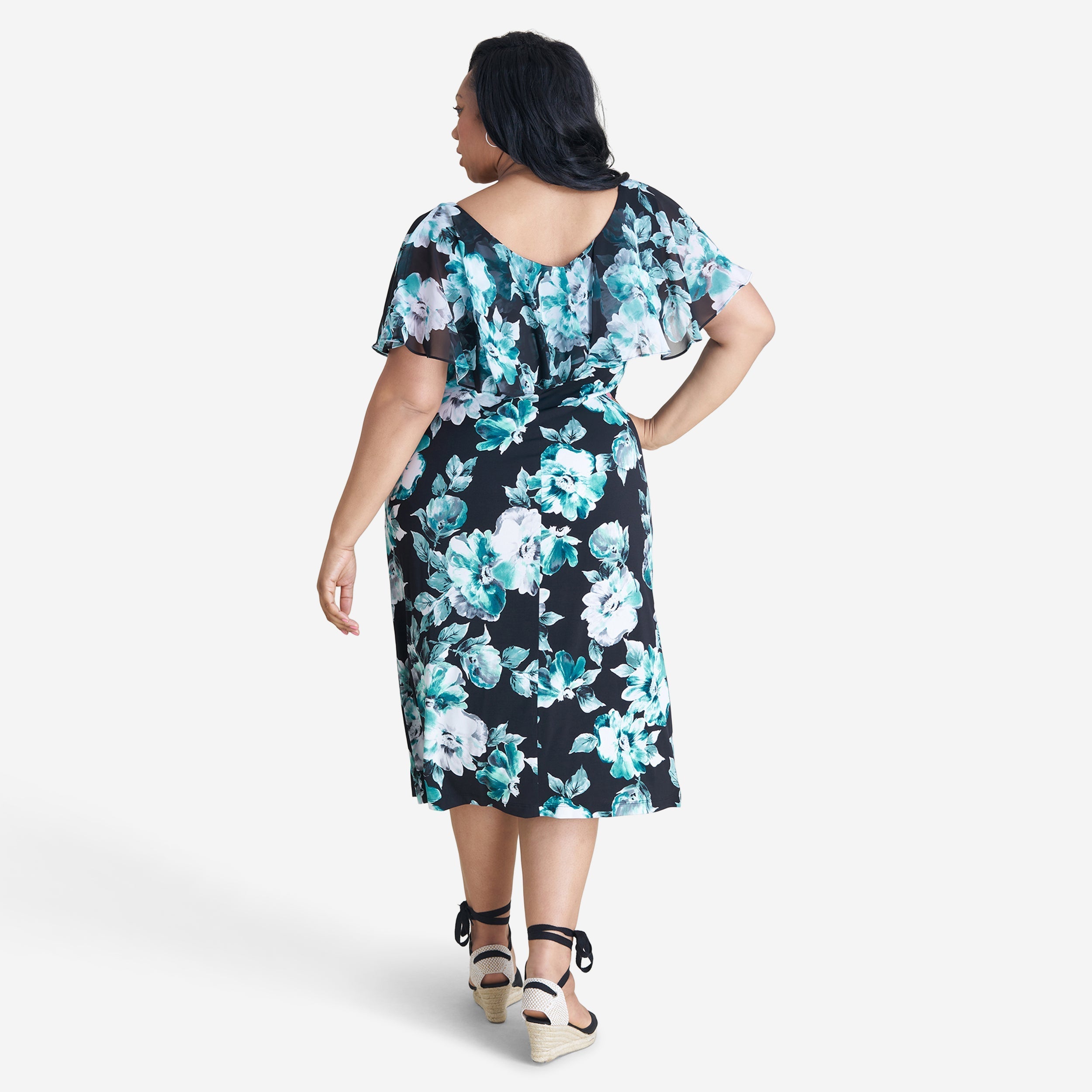 Woman posing wearing Teal Sunny Teal Floral Midi Dress from Connected Apparel