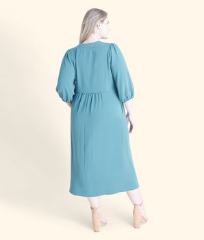 Woman posing wearing Dusty Teal Tabi Two-Pocket Dress from Connected Apparel