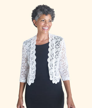 Woman posing wearing White Talula Scalloped Lace White Shrug from Connected Apparel