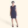 Woman posing wearing Navy/Spice Tina Cowl Neck Dress from Connected Apparel