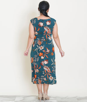 Woman posing wearing Forrest Tonya Forest Green Cowl Neck Midi Dress from Connected Apparel
