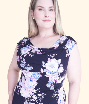 Woman posing wearing Navy/Orchid Tonya Orchid Floral Midi Dress from Connected Apparel