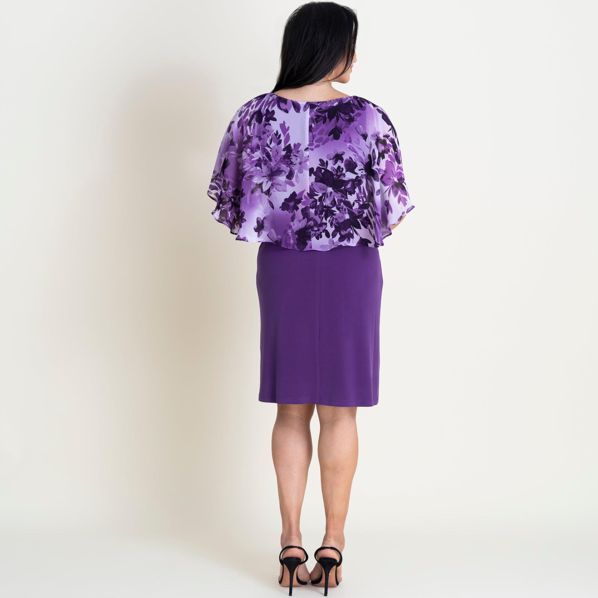 Woman posing wearing Purple Alyssa Purple Floral Cape Dress from Connected Apparel