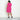 Woman posing wearing Fuchsia Bobbi Fuchsia X-neck Dress from Connected Apparel