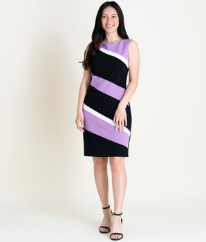 Woman posing wearing Orchid/Ivory/Black Bridget Color Block Sheath Dress from Connected Apparel