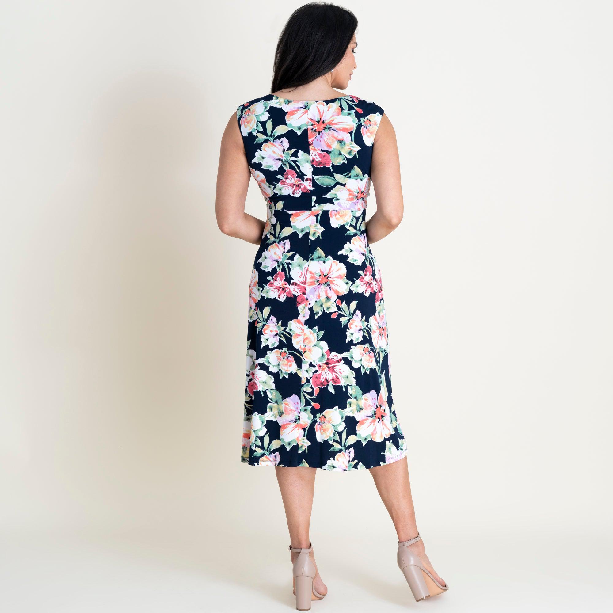 Woman posing wearing Navy Callie Knotted Fit and Flare Dress from Connected Apparel