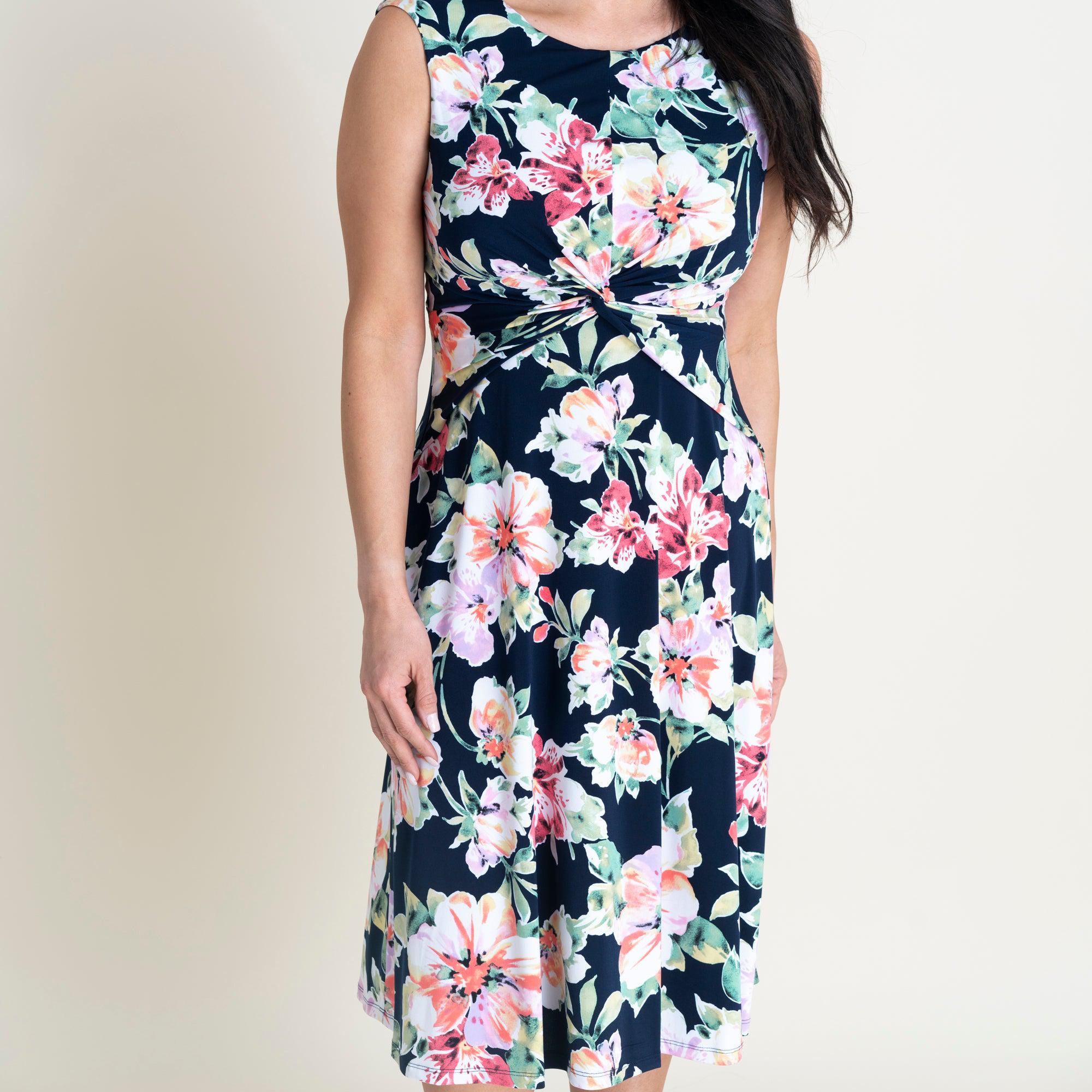 Woman posing wearing Navy Callie Knotted Fit and Flare Dress from Connected Apparel