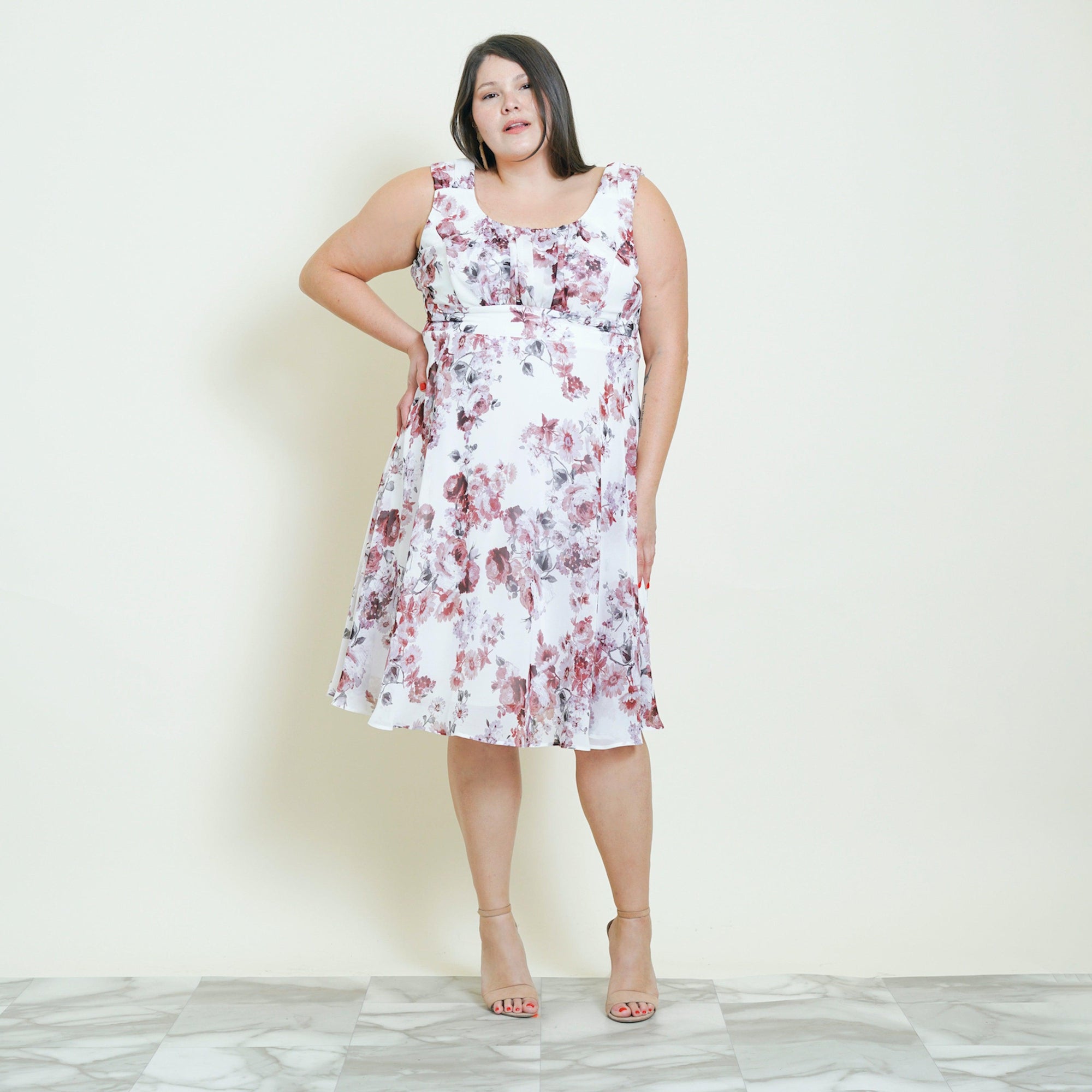 Woman posing wearing Mauve Carly Mauve Floral Chiffon Dress from Connected Apparel