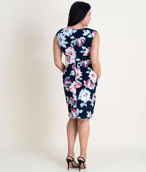 Woman posing wearing Navy/Multicolor Diana Floral Surplice Bodycon Dress from Connected Apparel