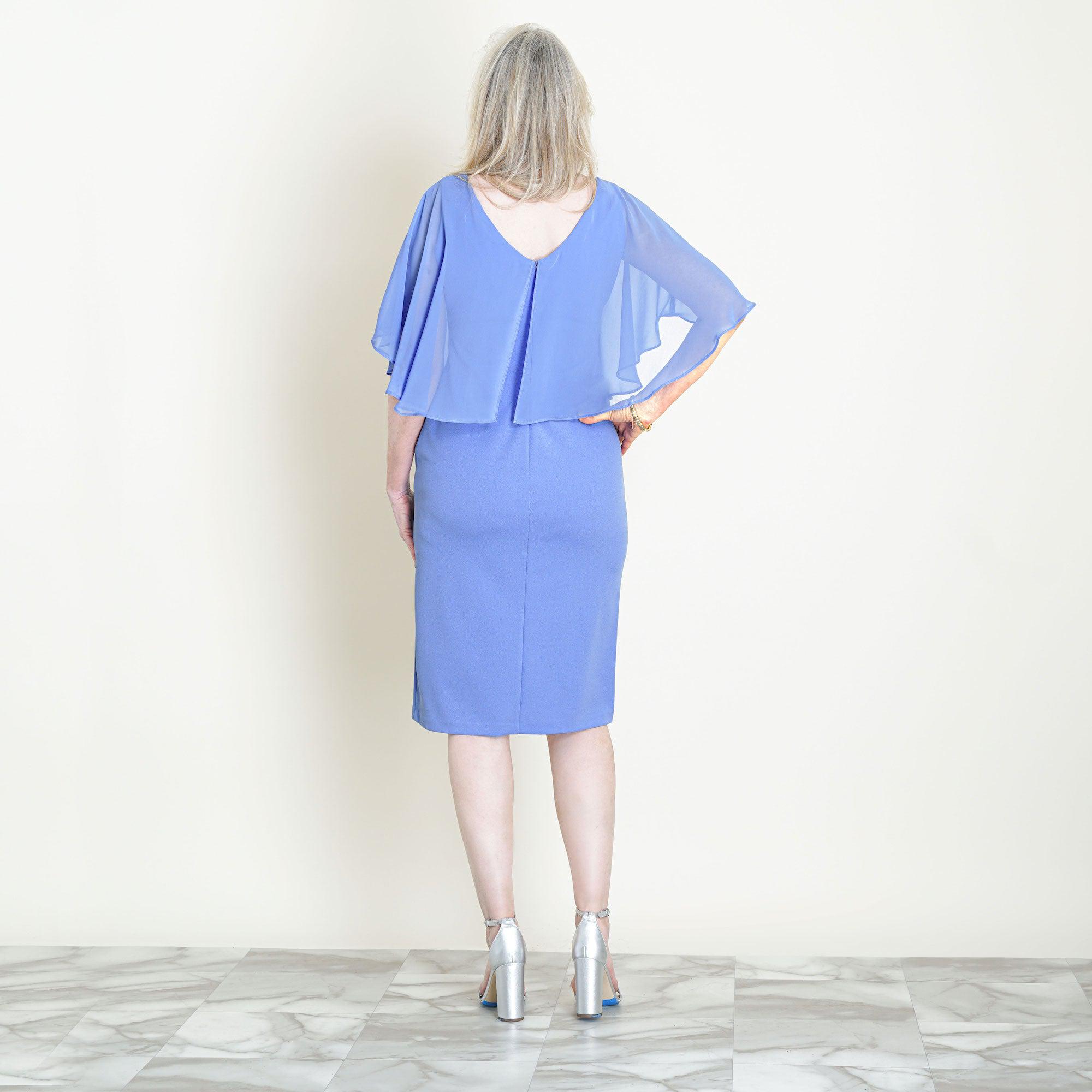 Woman posing wearing New Periwinkle Elsa Periwinkle Midi Capelet Dress from Connected Apparel