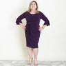 Woman posing wearing Aubergine Lisa 2.0 Aubergine Faux Wrap Dress from Connected Apparel