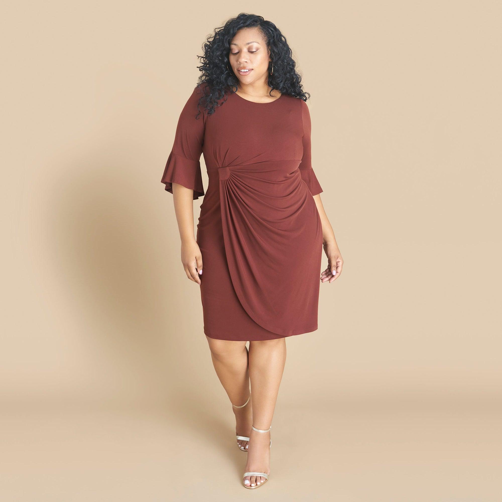 Woman posing wearing Cinnamon Lisa 2.0 Cinnamon Faux Wrap Dress from Connected Apparel