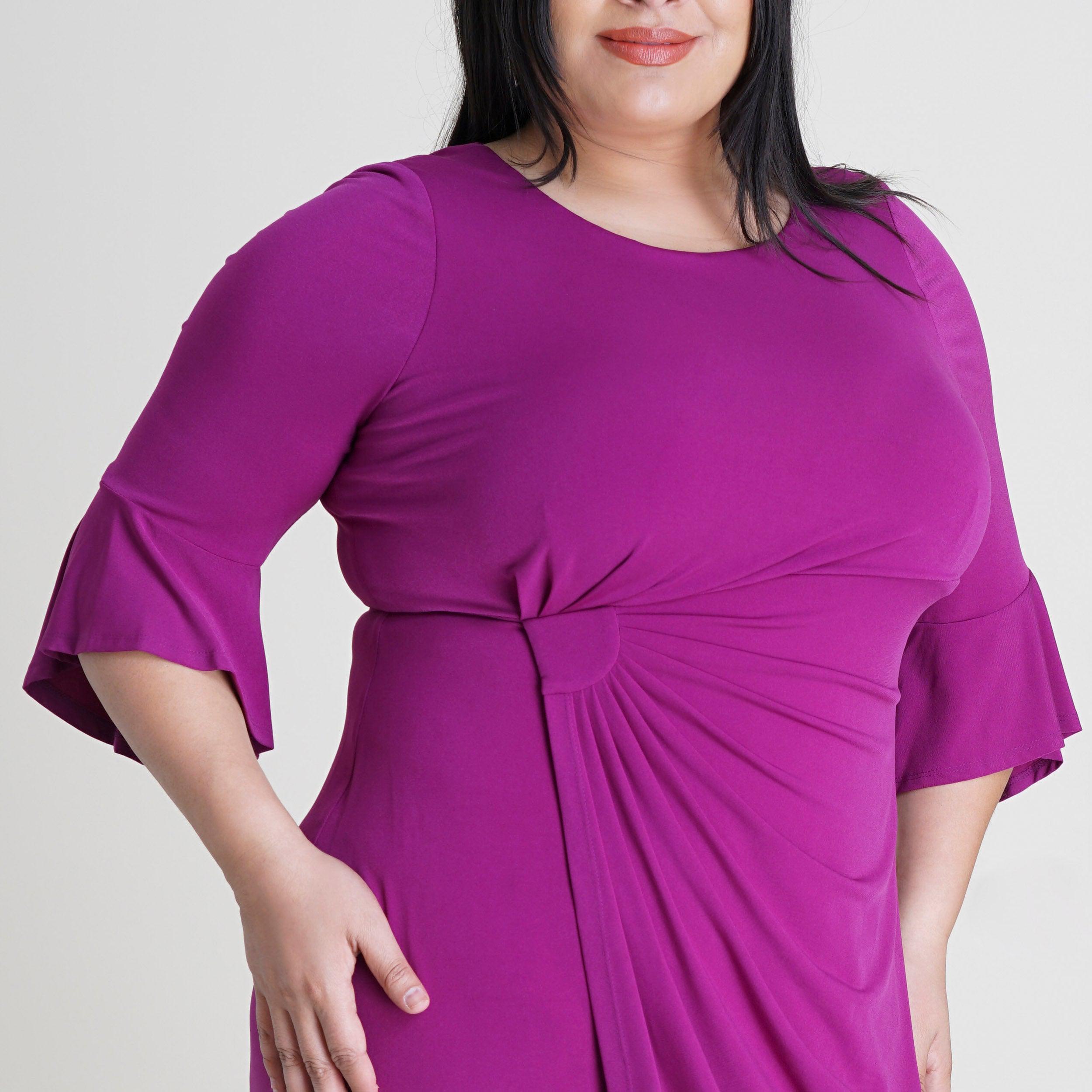 Woman posing wearing Magenta Lisa 2.0 Magenta Faux Wrap Dress from Connected Apparel