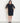 Woman posing wearing Black Lisette Chiffon Sleeve Little Black Dress from Connected Apparel