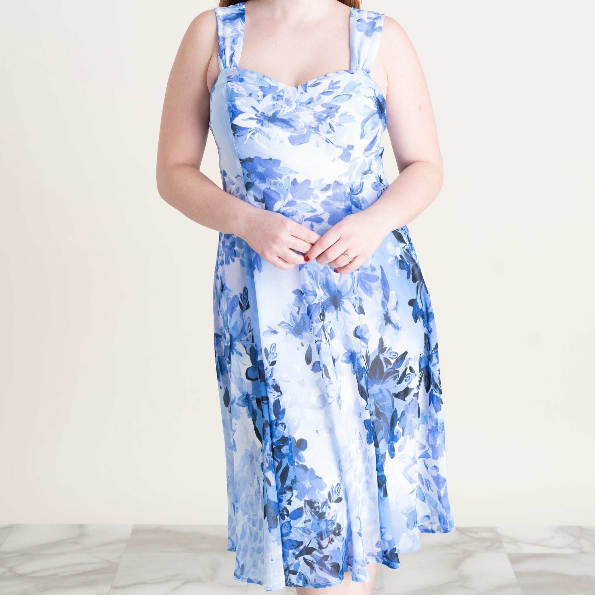 Woman posing wearing Periwinkle Mary Periwinkle Floral Chiffon Dress with Shrug from Connected Apparel