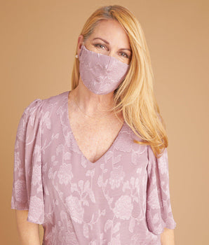 Woman posing wearing Mauve Mauve Burnout Chiffon Face Mask from Connected Apparel