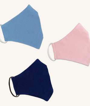 Woman posing wearing Multicolor The Essential Face Mask Multipack in Blue (Set of 3) from Connected Apparel
