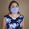 Woman posing wearing Multicolor The Essential Face Mask Multipack in Lavender (Set of 3) from Connected Apparel