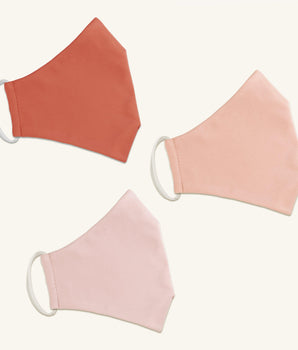 Woman posing wearing Multicolor The Essential Face Mask Multipack in Peach (Set of 3) from Connected Apparel