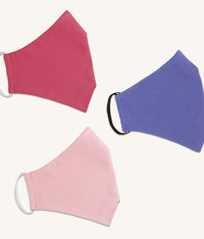 Woman posing wearing Multicolor The Essential Face Mask Multipack in Pink (Set of 3) from Connected Apparel