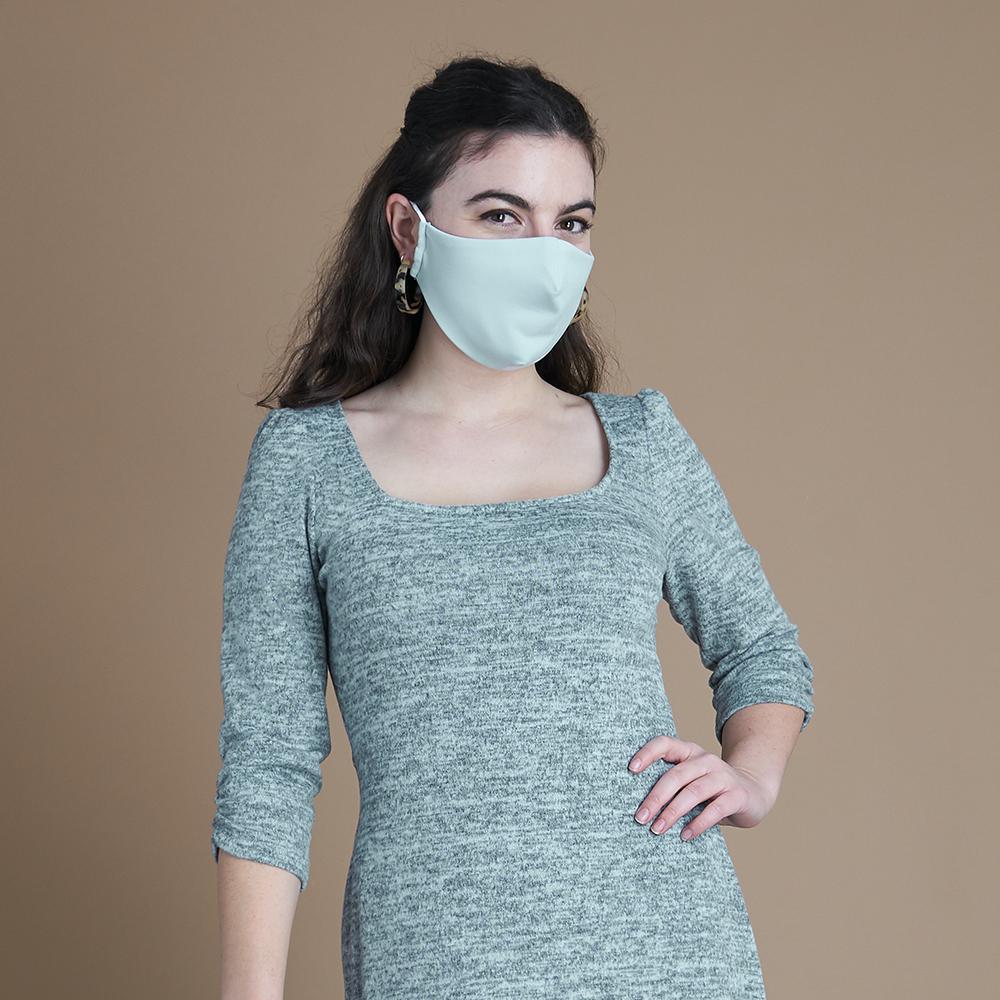 Woman posing wearing Multicolor The Essential Face Mask Multipack in Seafoam (Set of 3) from Connected Apparel